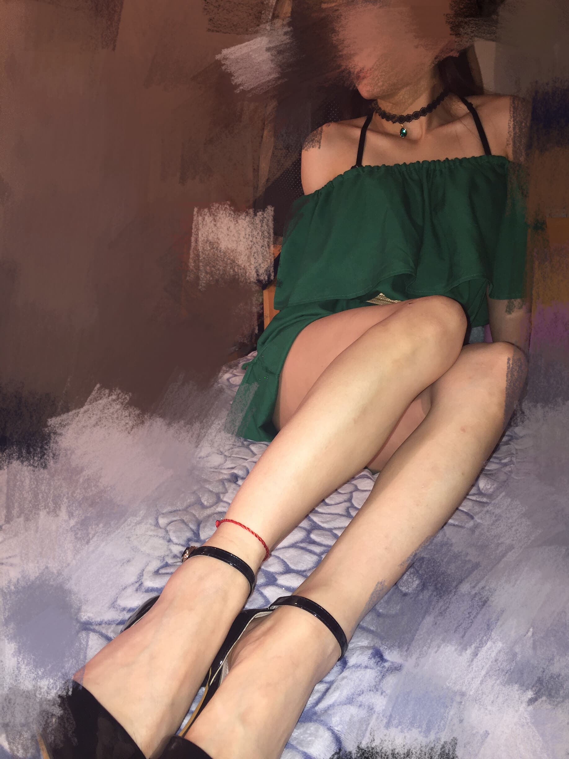 Close-up of glossy black tights hugging the arch, subtle sheen catching light as a bare toe presses against sheer fabric.